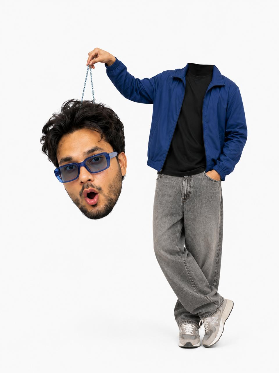 Surreal studio portrait of Sahid holding a miniature version of his own head